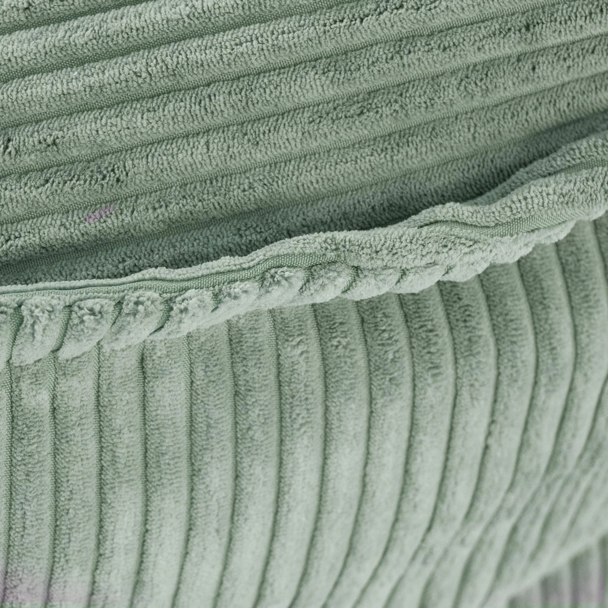 Matière velours côtelé de pouf vert