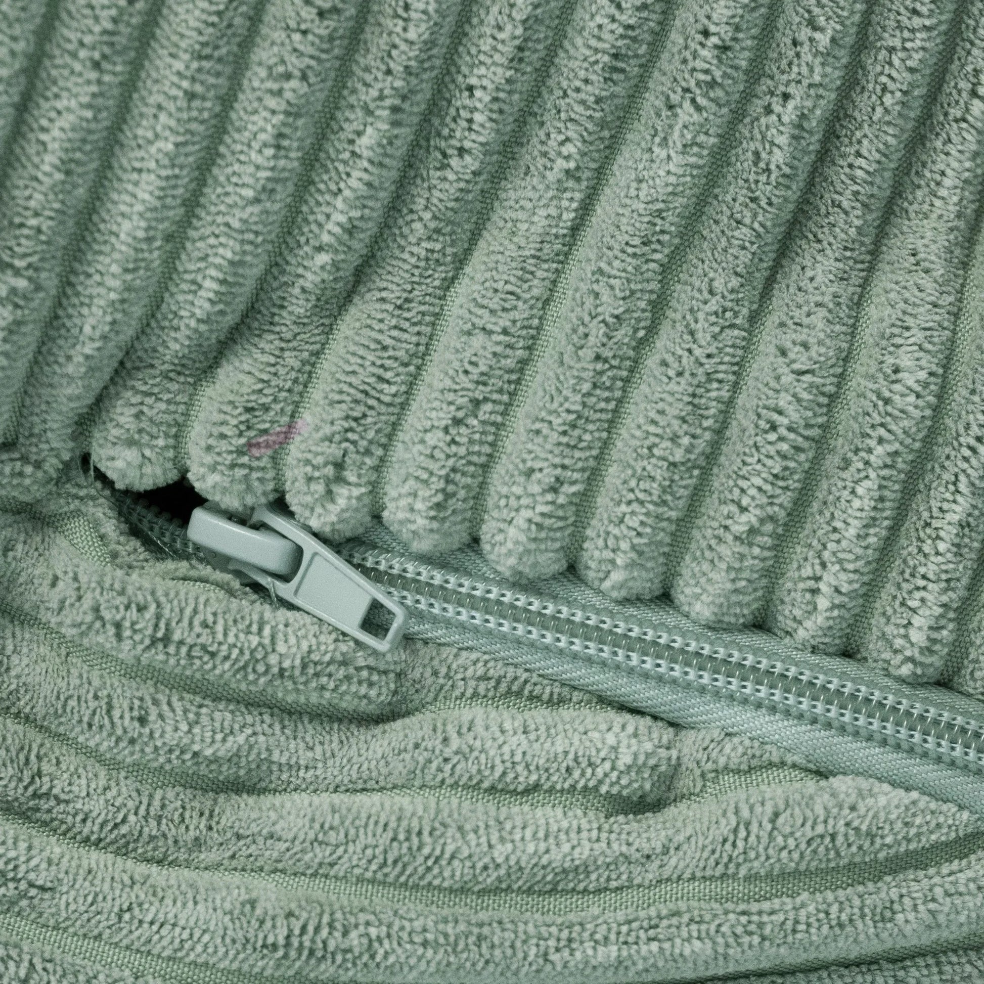 Matière velours côtelé de pouf vert avec fermeture